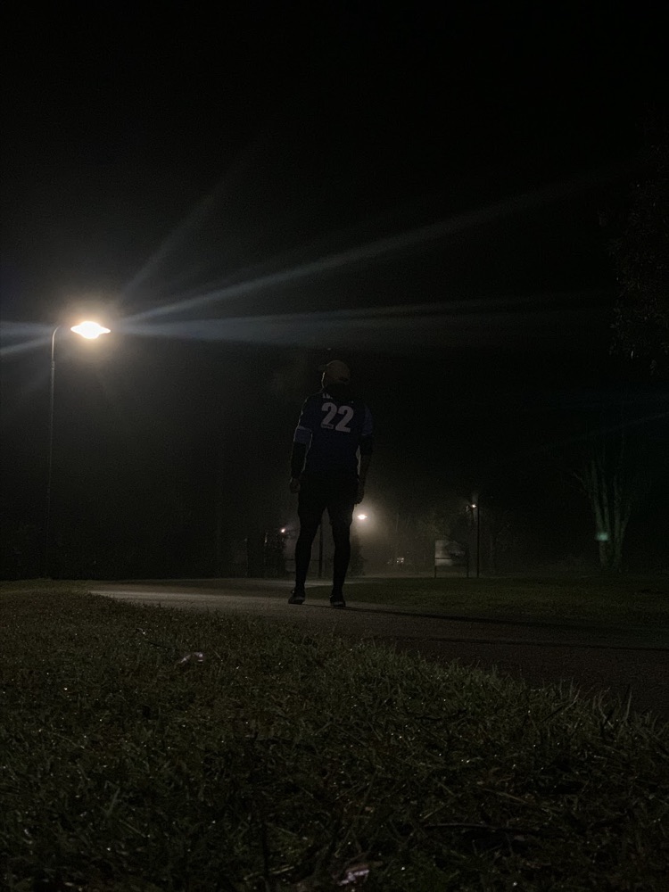Zach at night wearing a number 22 jersey